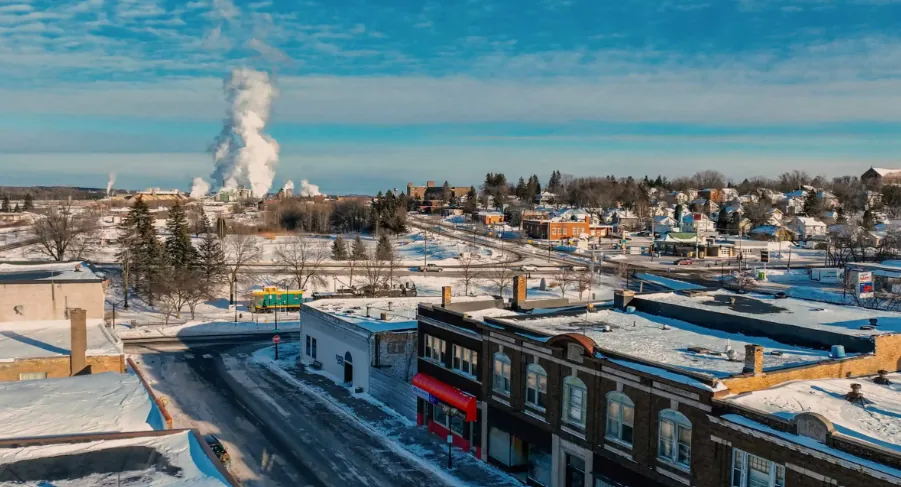 Downtown Cloquet, Minnesota in winter with the paper mill beyond
