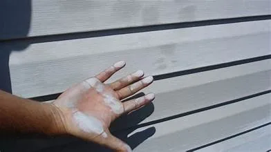 Oxidation and chalky siding before professional cleaning in Proctor, MN